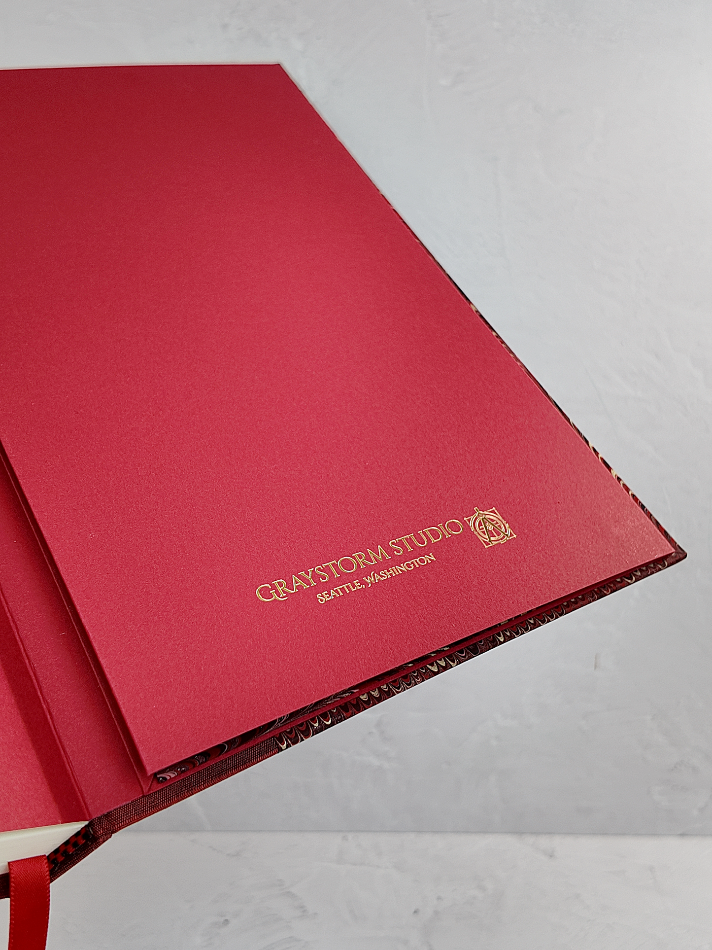 A5 160-page Hardcover Journal finished in Blood Red Japanese book cloth and Renato Crepaldi hand marbled paper