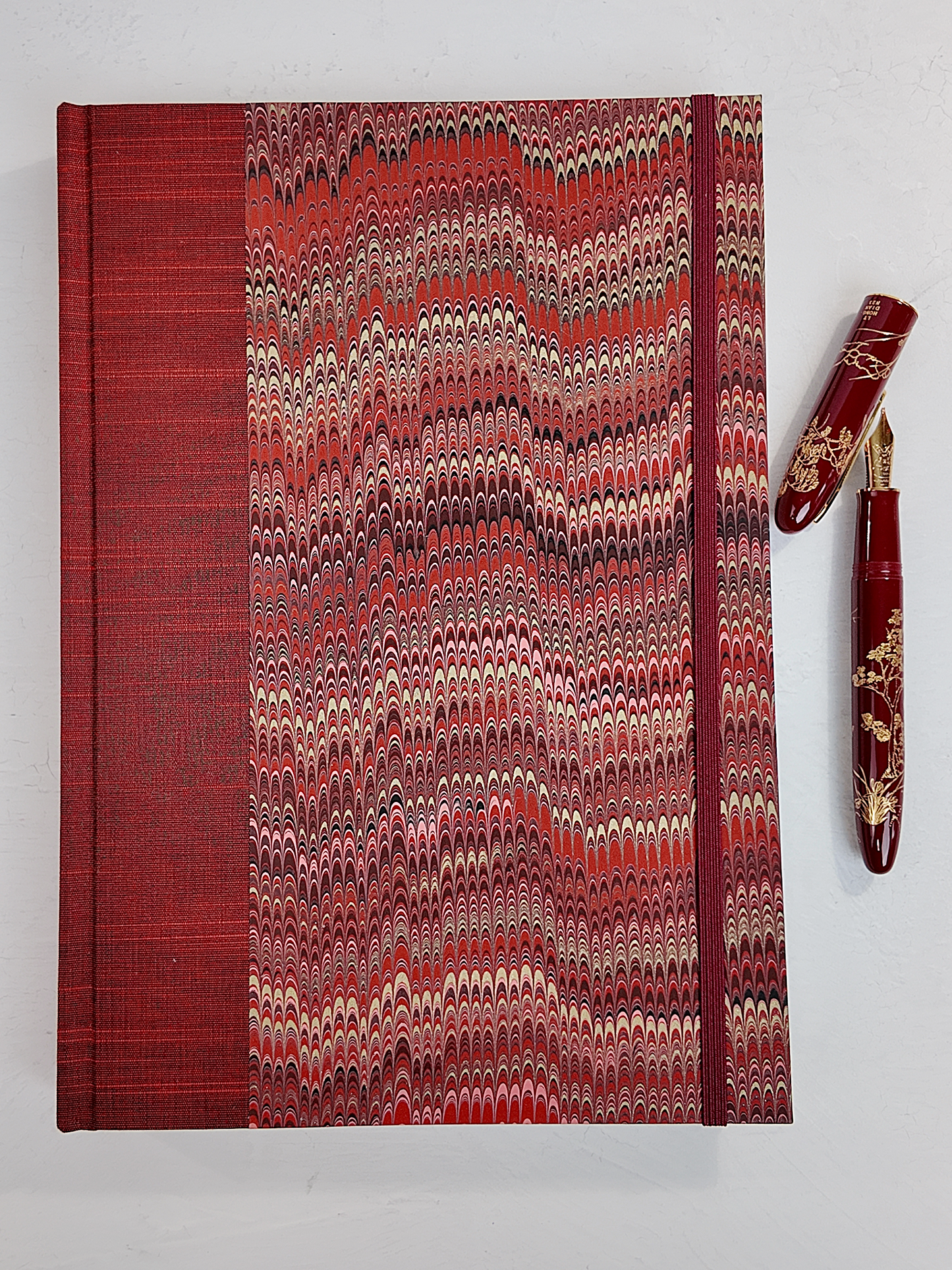 B5 192-page Hardcover Journal finished in Blood Red Japanese book cloth and Renato Crepaldi hand marbled paper