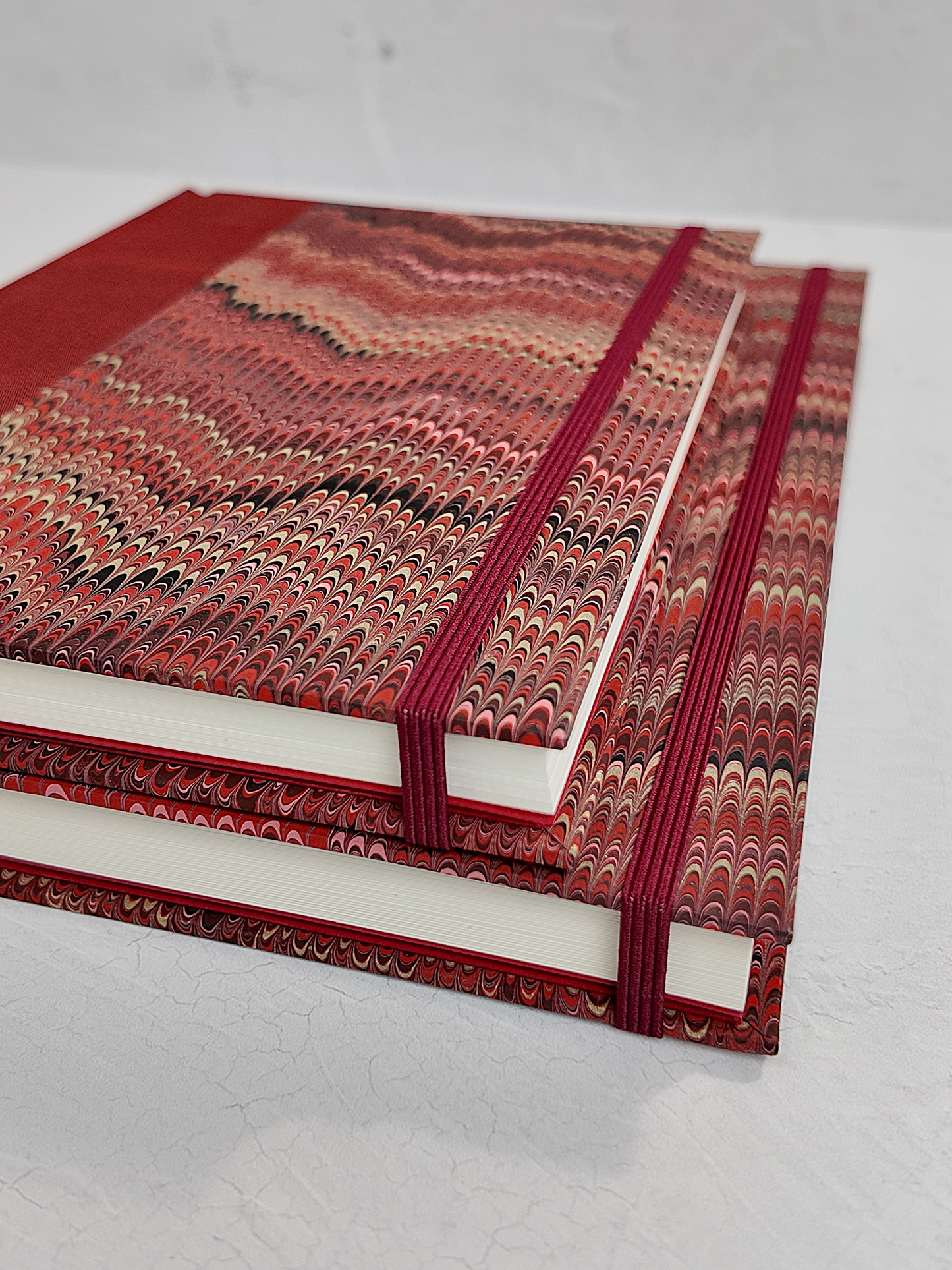 B5 192-page Hardcover Journal finished in Blood Red Japanese book cloth and Renato Crepaldi hand marbled paper