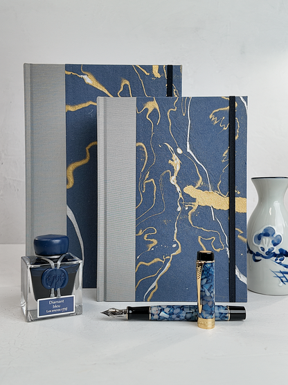 A5 160-page Hardcover Journal finished in Blue/Silver Japanese book cloth and hand marbled Indian paper