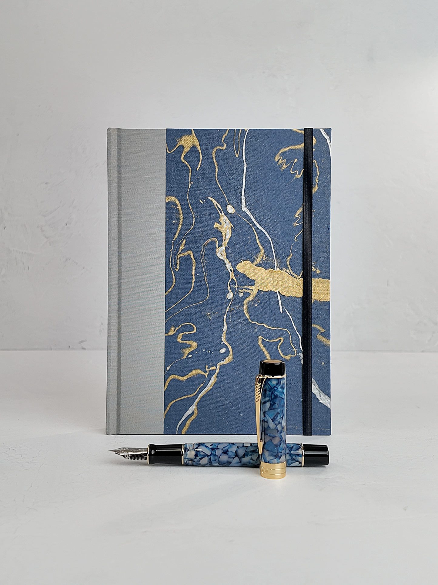 A5 160-page Hardcover Journal finished in Blue/Silver Japanese book cloth and hand marbled Indian paper