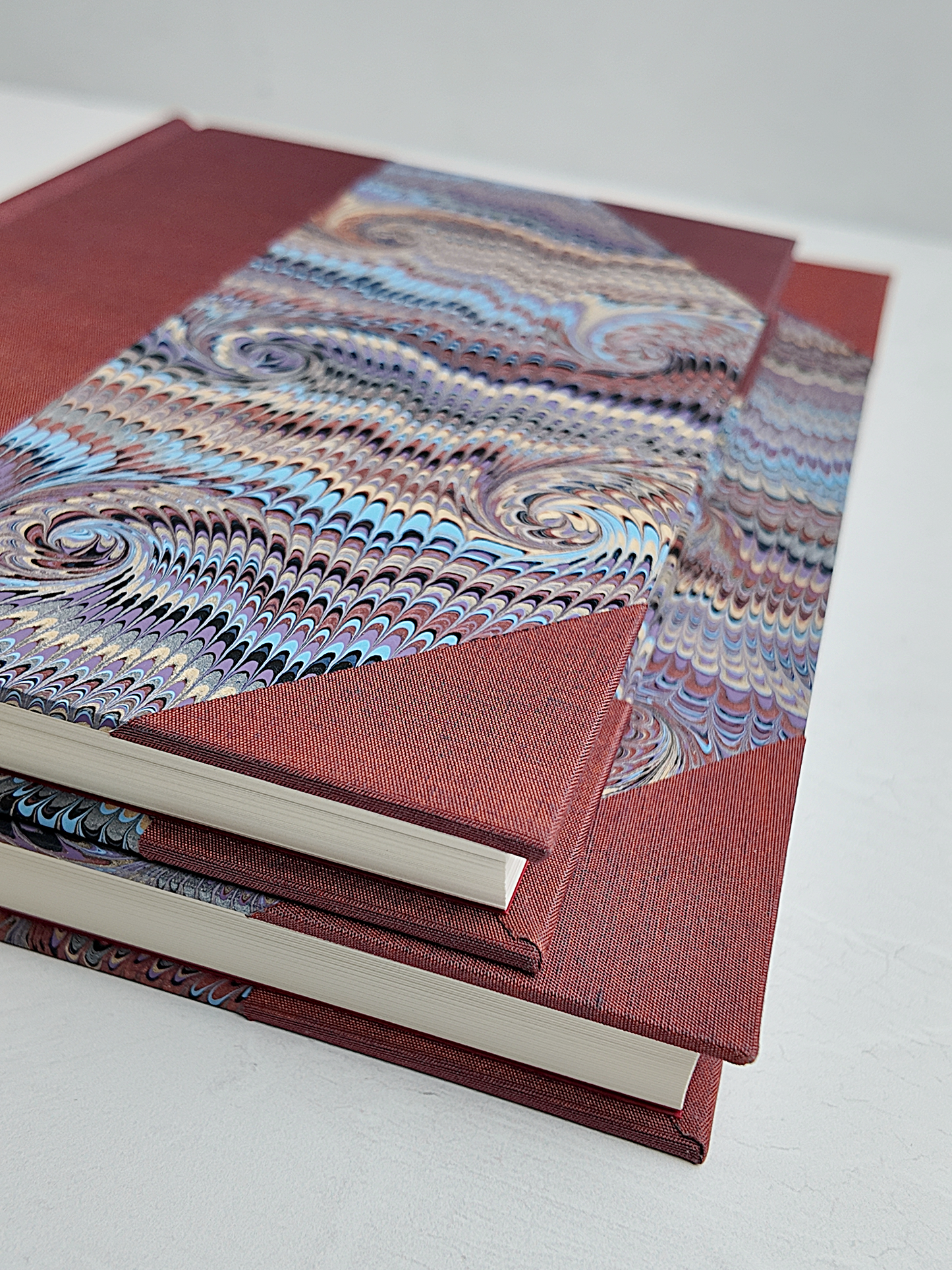 NEW A5 160-page Hardcover Journal finished in Rust Blue Japanese book cloth and Renato Crepaldi hand marbled paper