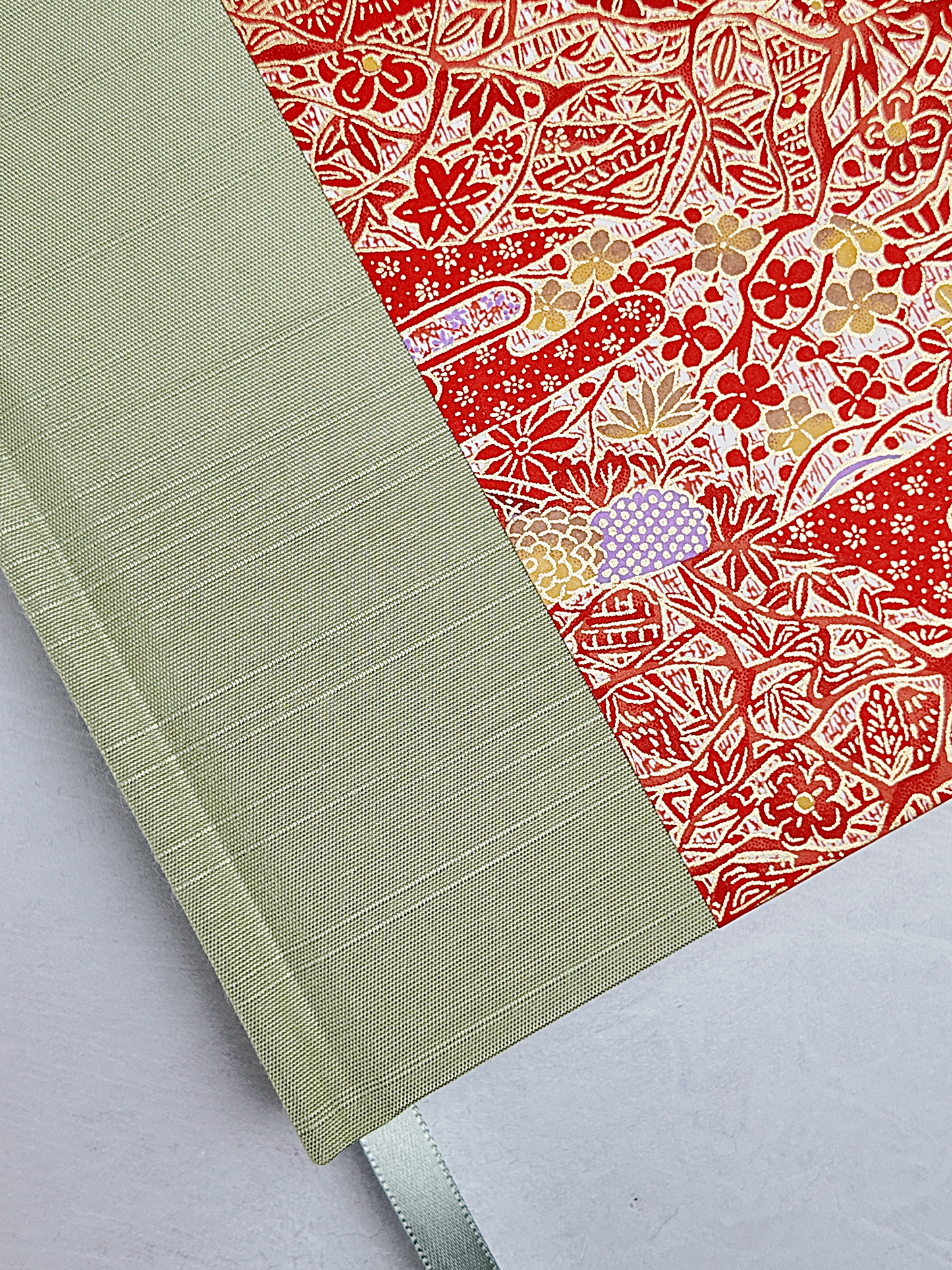 B5 192-page Hardcover Journal finished in Celery Japanese book cloth and Orange and Purple Chiyogami Paper Chiyogami