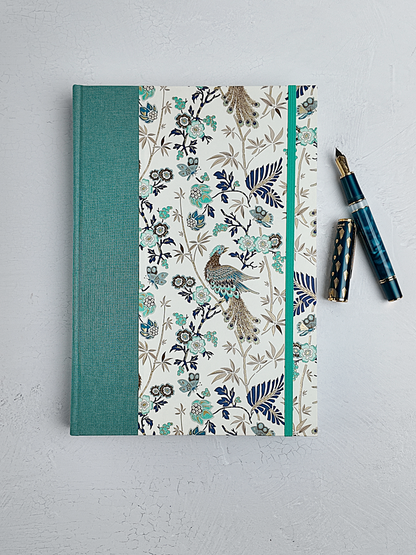 B5 192-page Hardcover Journal finished in Light Blue Verona book cloth and Peacock themed Florentine Print