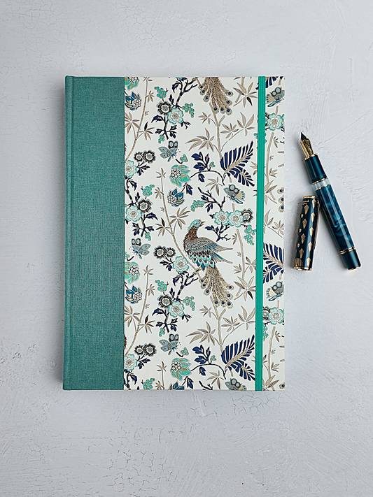 B5 192-page Hardcover Journal finished in Light Blue Verona book cloth and Peacock themed Florentine Print