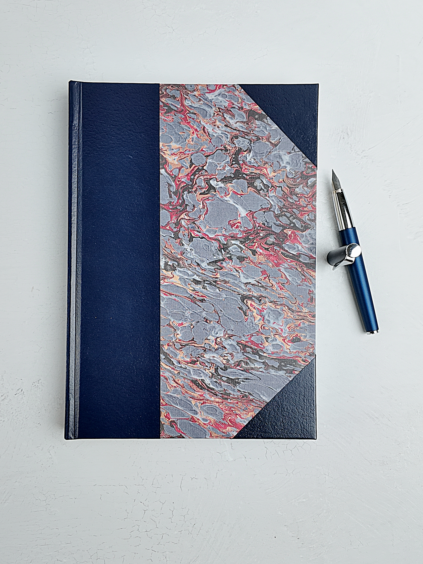 B5 192-page Hardcover Journal finished in Navy faux leather and French Marble paper