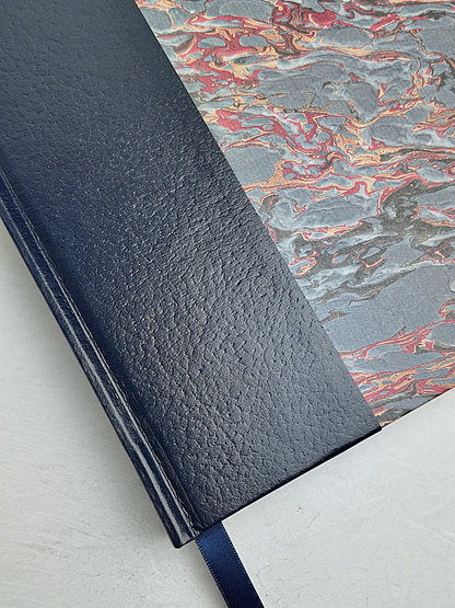 B5 192-page Hardcover Journal finished in Navy faux leather and French Marble paper