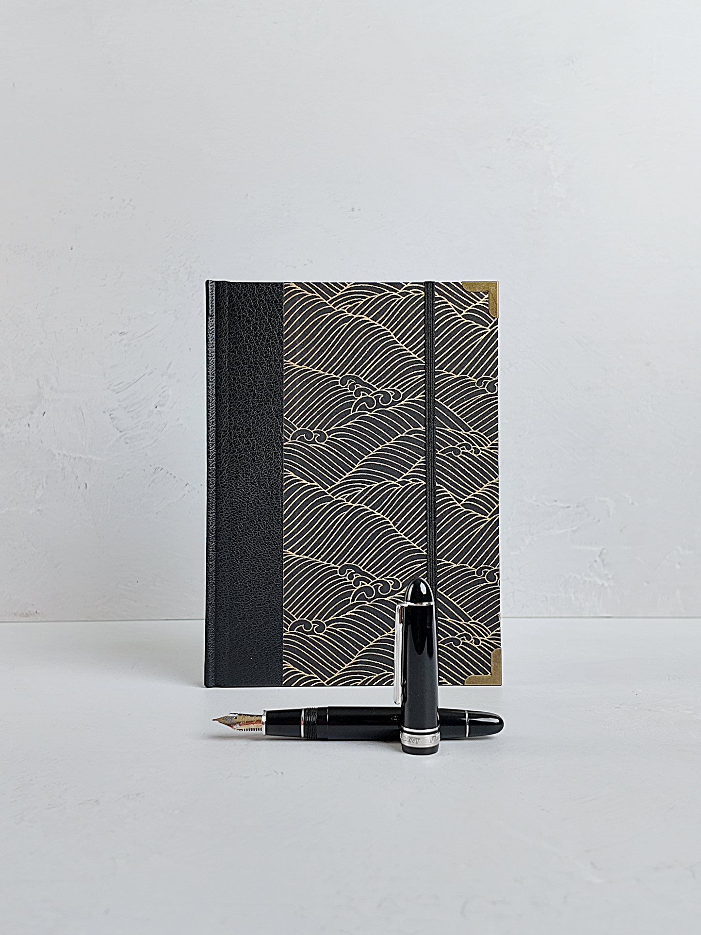 A5 160-page Hardcover Journal finished in black faux leather with gold waves on black Chiyogami Paper