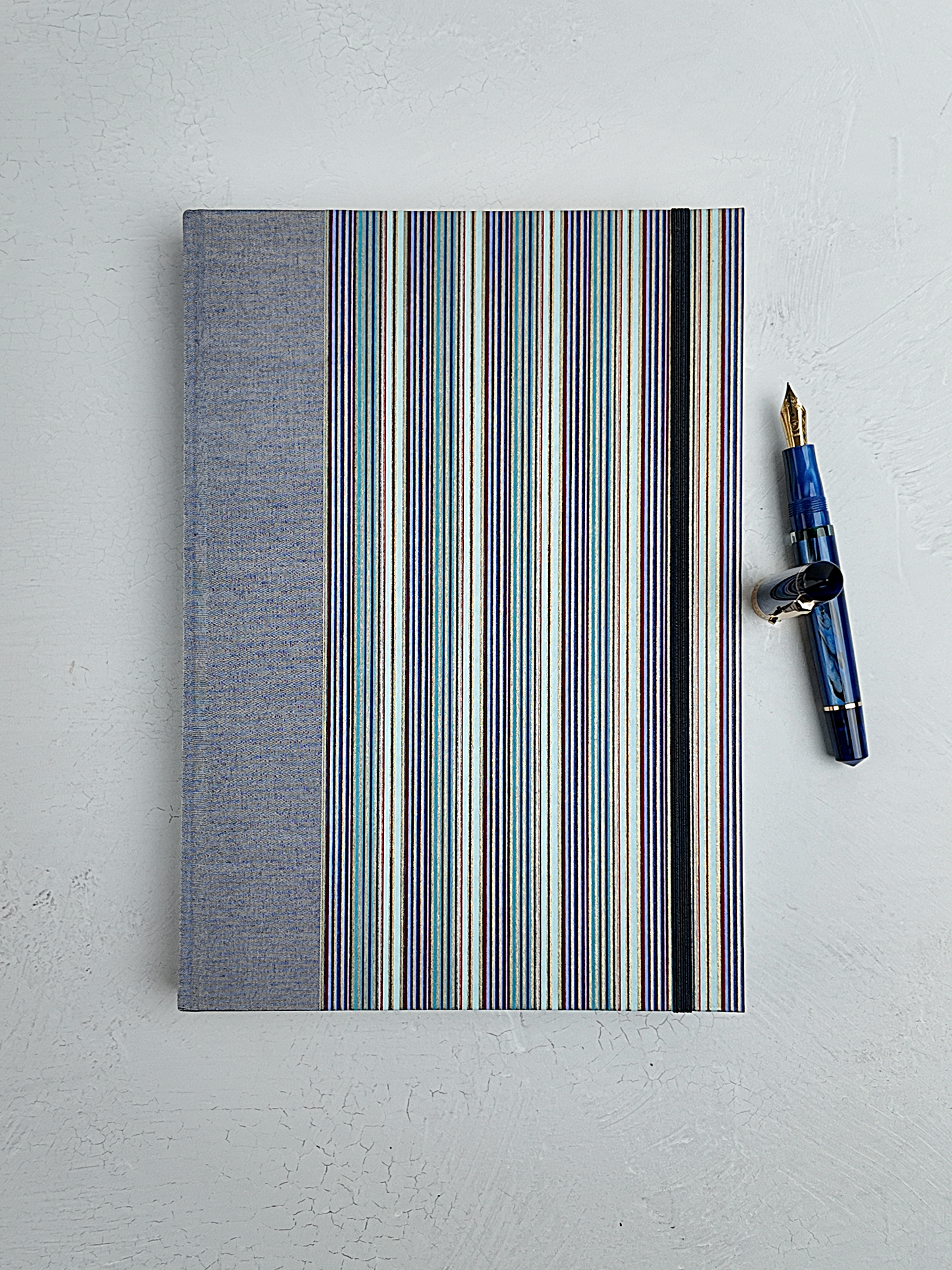 B5 192-page Hardcover Journal finished in Steel Blue Japanese book cloth and pinstripe Chiyogami paper
