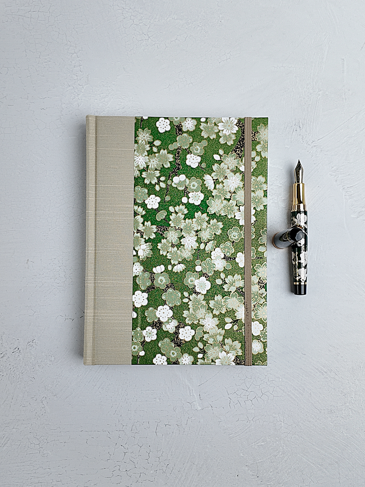 A5 160-page Hardcover Journal finished in Platinum Japanese book cloth and green Cherry Blossom Chiyogami Paper