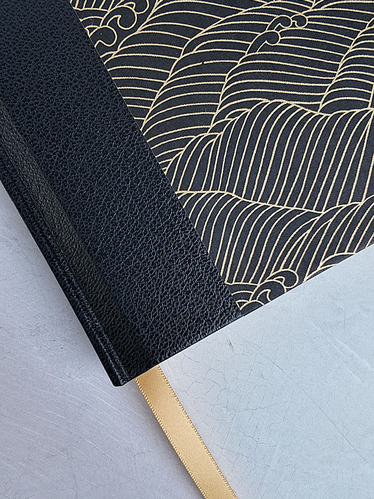 A5 160-page Hardcover Journal finished in black faux leather with gold waves on black Chiyogami Paper