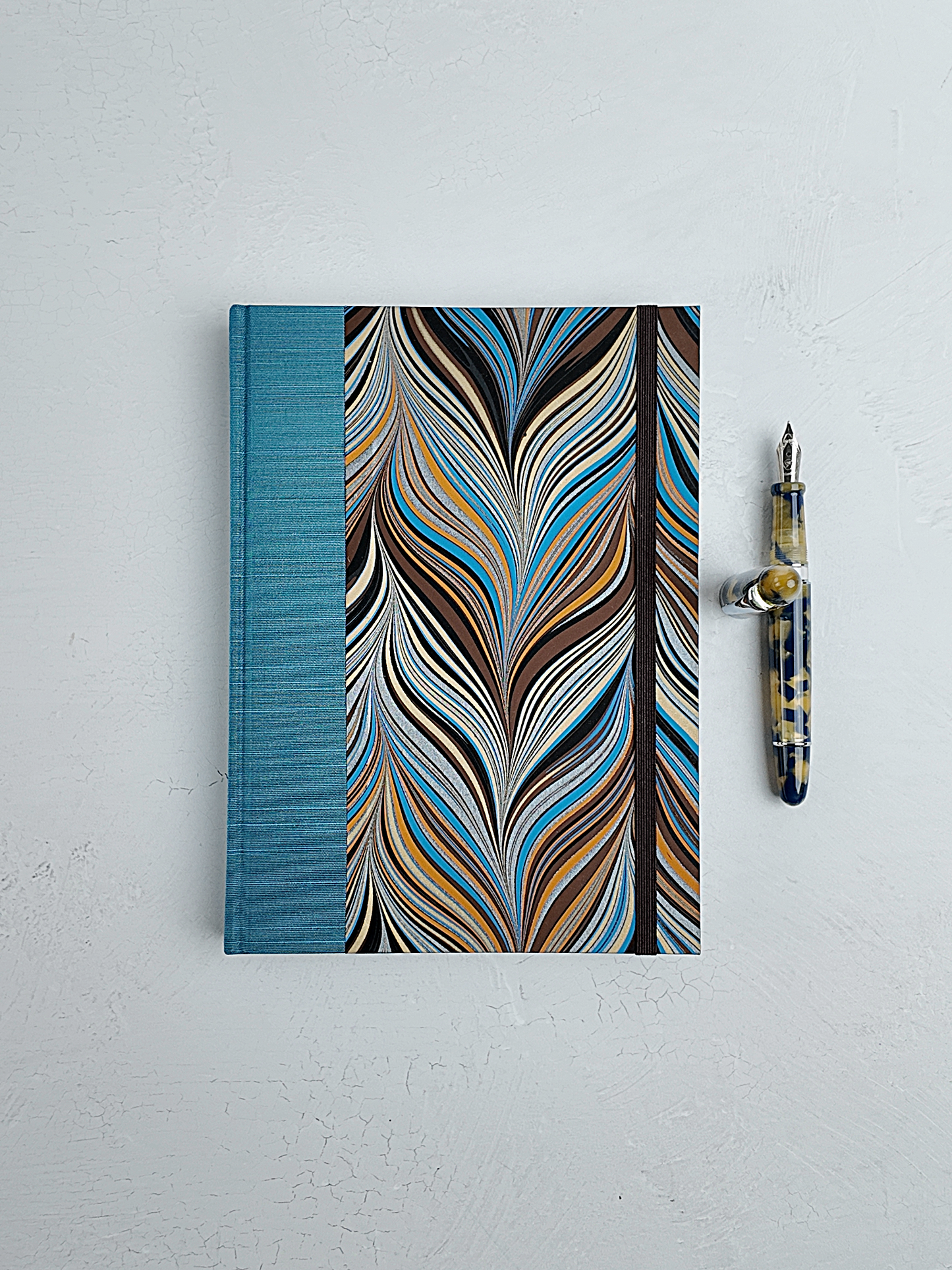A5 160-page Hardcover Journal finished in Marine Blue Japanese book cloth and Renato Crepaldi Marble paper