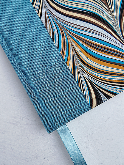 A5 160-page Hardcover Journal finished in Marine Blue Japanese book cloth and Renato Crepaldi Marble paper