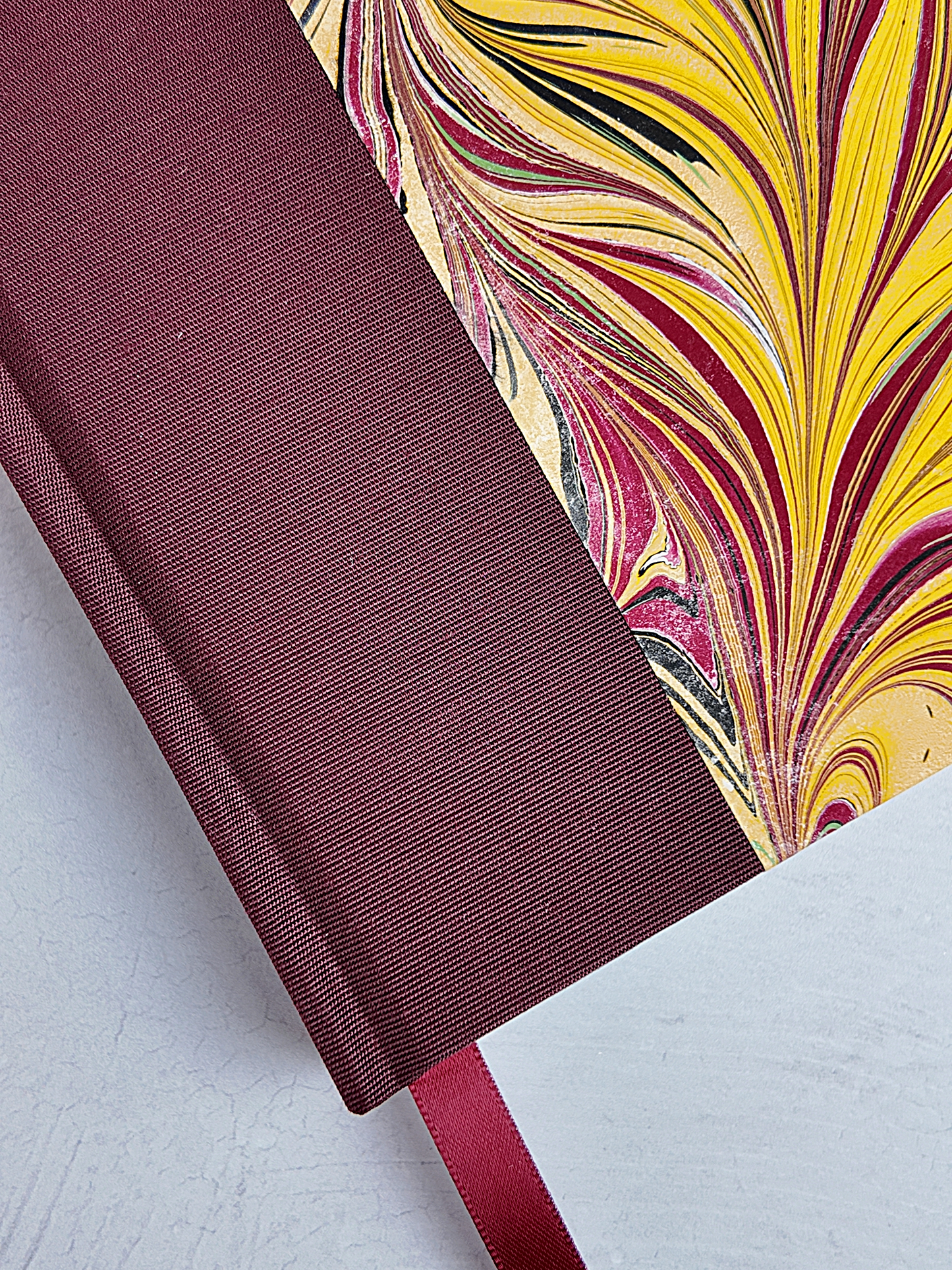 WABI-SABI A5 160-page Hardcover finished in Maroon Japanese book cloth and handmade marble paper