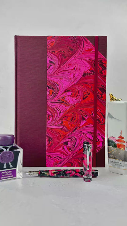 B5 192-page Hardcover Journal finished in Maroon Japanese book cloth and red/pink hand marbled paper by Daniel Gaál