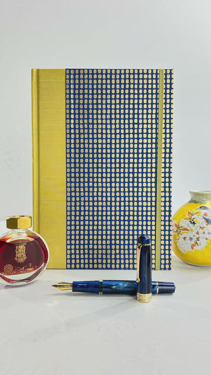 A5 160-page Hardcover Journal finished in Yellow Gold Japanese book cloth and blue and gold Chiyogami Paper