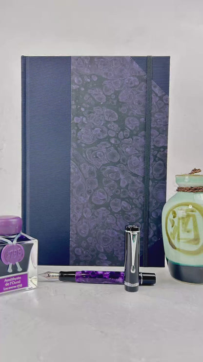 B5 192-page Hardcover Journal finished in Black Japanese book cloth and indigo hand marbled paper by Daniel Gaál