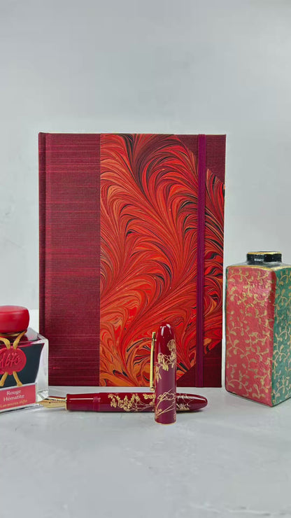 A5 160-page Hardcover Journal finished in Dark Red Japanese book cloth and hand marbled paper by Daniel Gaál