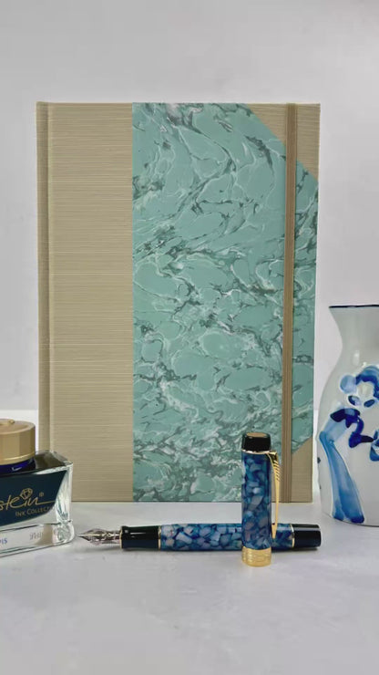 A5 160-page Hardcover Journal finished in Platinum Japanese book cloth and light blue French Marble Paper
