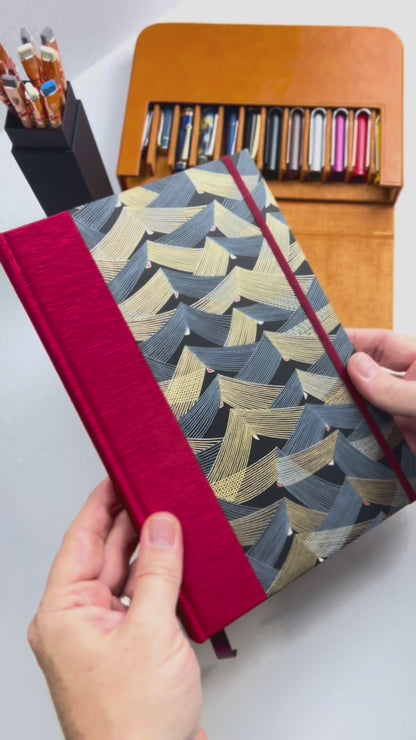 A5 160-page Hardcover Hardcover Notebook finished in Cardinal Red Japanese Bookcloth and Black and Gold Chiyogami Japanese Paper
