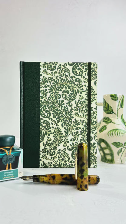 A5 160-page Hardcover Journal finished in Green Vaux Leather and green and gold fern Italian Florentine print